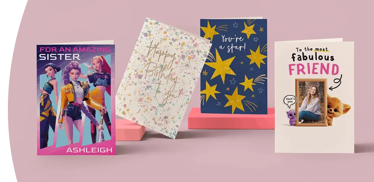Selection of greeting cards including personalised sister, football-themed birthday, star design, and photo friend cards displayed on a green background. Selection of greeting cards including personalised sister, football-themed birthday, star design, and photo friend cards displayed on a green background.