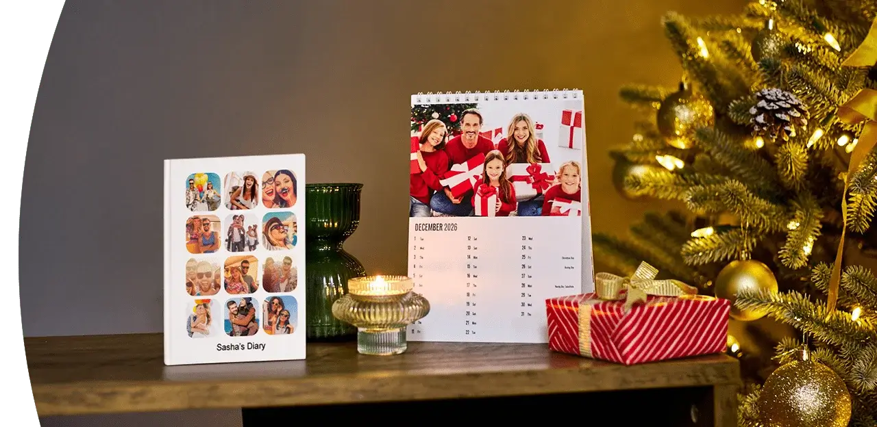 Wall calendars and planners on a desk, including a 2026 family organiser, a March 2026 calendar, notebooks, and a reed diffuser against a dark wall. Wall calendars and planners on a desk, including a 2026 family organiser, a March 2026 calendar, notebooks, and a reed diffuser against a dark wall.