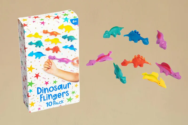 A pack of dinosaur finger toys displayed beside assorted colourful dinosaur-shaped figures in blue, pink, yellow, orange and green. The packaging reads ‘Dinosaur Flingers 10 Pack’ and features a demonstration of the stretchy party favours in use.