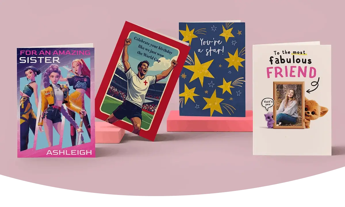 Selection of greeting cards including personalised sister, football-themed birthday, star design, and photo friend cards displayed on a green background.