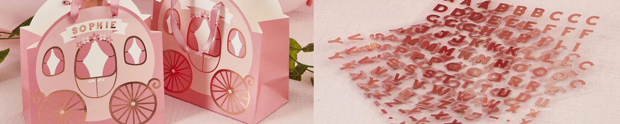 A close-up of personalised princess party favour boxes shaped like fairytale carriages, featuring pink and gold carriage designs with ribbon handles and the name ‘Sophie’ displayed on the front. A close-up of personalised princess party favour boxes shaped like fairytale carriages, featuring pink and gold carriage designs with ribbon handles and the name ‘Sophie’ displayed on the front.
