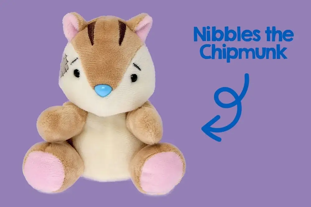 A plush toy resembling a chipmunk with a light brown and cream body, pink ears, and feet. The toy has a blue nose, black eyes, and three dark brown stripes on its head. There is also a small gray patch on the left side of its face. A plush toy resembling a chipmunk with a light brown and cream body, pink ears, and feet. The toy has a blue nose, black eyes, and three dark brown stripes on its head. There is also a small gray patch on the left side of its face.