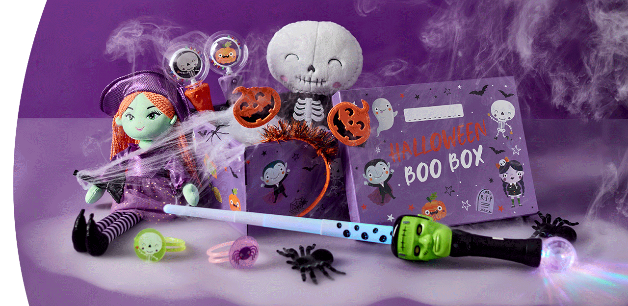 Halloween Boo Box filled with spooky toys, glow accessories, decorations and a plush skeleton character, displayed with cobwebs and smoke effects against a purple background.