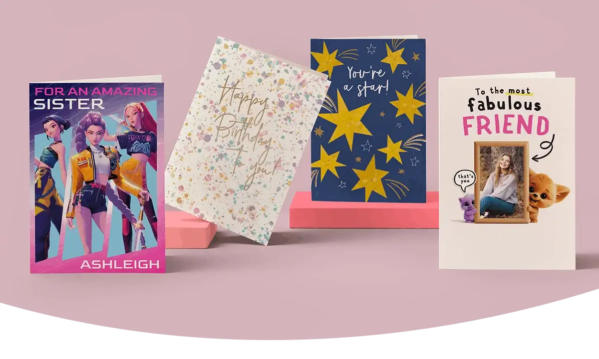 Selection of greeting cards including personalised sister, football-themed birthday, star design, and photo friend cards displayed on a green background. Selection of greeting cards including personalised sister, football-themed birthday, star design, and photo friend cards displayed on a green background.