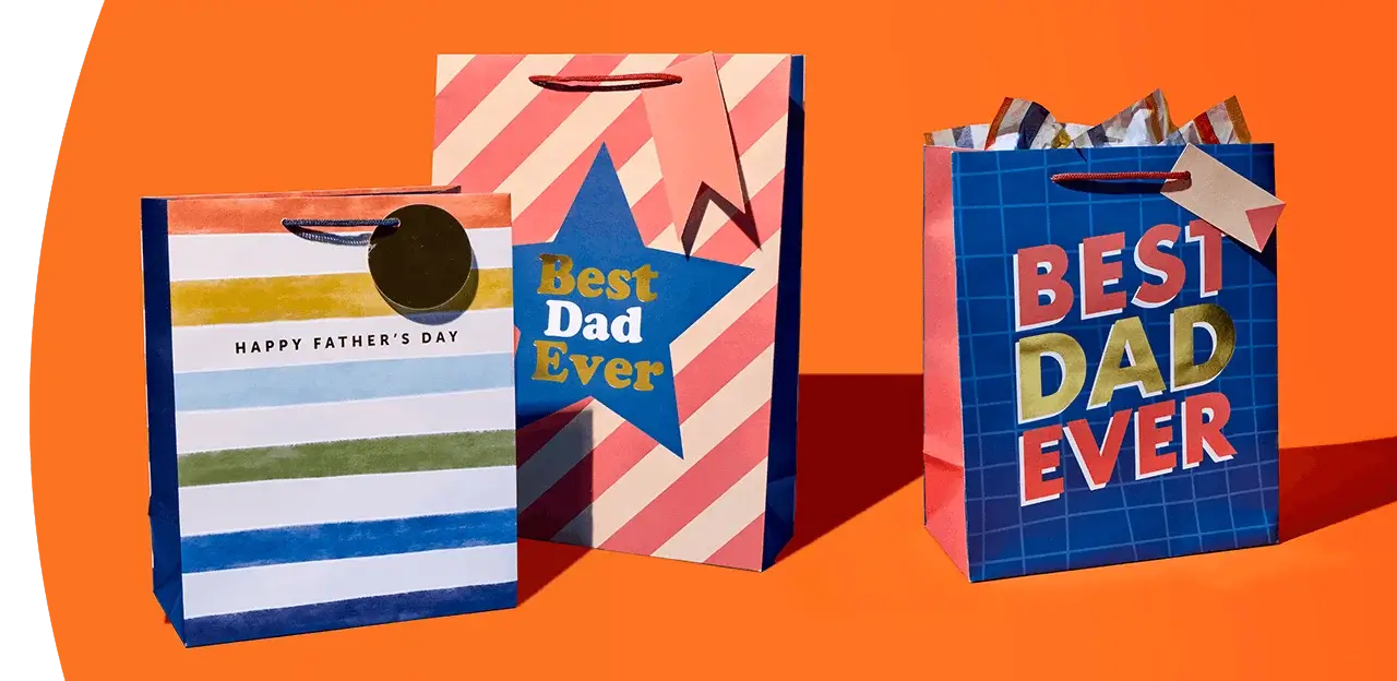 Three Father’s Day gift bags with colourful stripe, star, and grid designs labelled Best Dad Ever on an orange background Three Father’s Day gift bags with colourful stripe, star, and grid designs labelled Best Dad Ever on an orange background