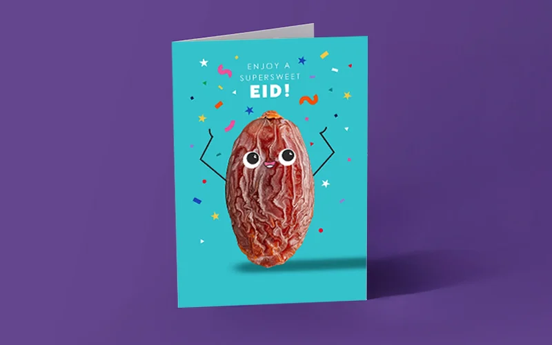 A bright turquoise Eid greeting card with a cartoon-style date illustration surrounded by colourful confetti, featuring the message ‘Enjoy a supersweet Eid!