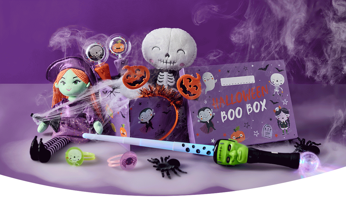 Halloween Boo Box filled with spooky toys, glow accessories, decorations and a plush skeleton character, displayed with cobwebs and smoke effects against a purple background.