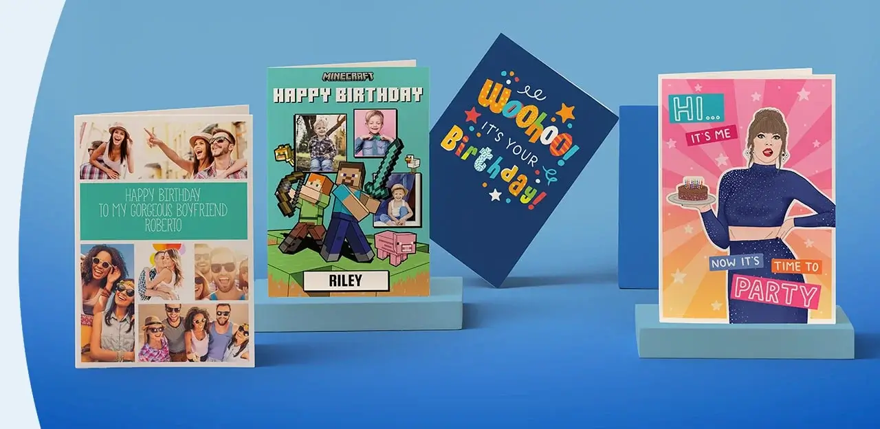 Four birthday cards on a blue background: a photo collage card saying 'Happy Birthday to my gorgeous boyfriend Roberto', a Minecraft-themed card with 'Minecraft Happy Birthday Riley', a dark blue card with 'Woohoo! It's your Birthday!', and a card with a person holding a cake saying 'Hi... it's me. Now it's time to party