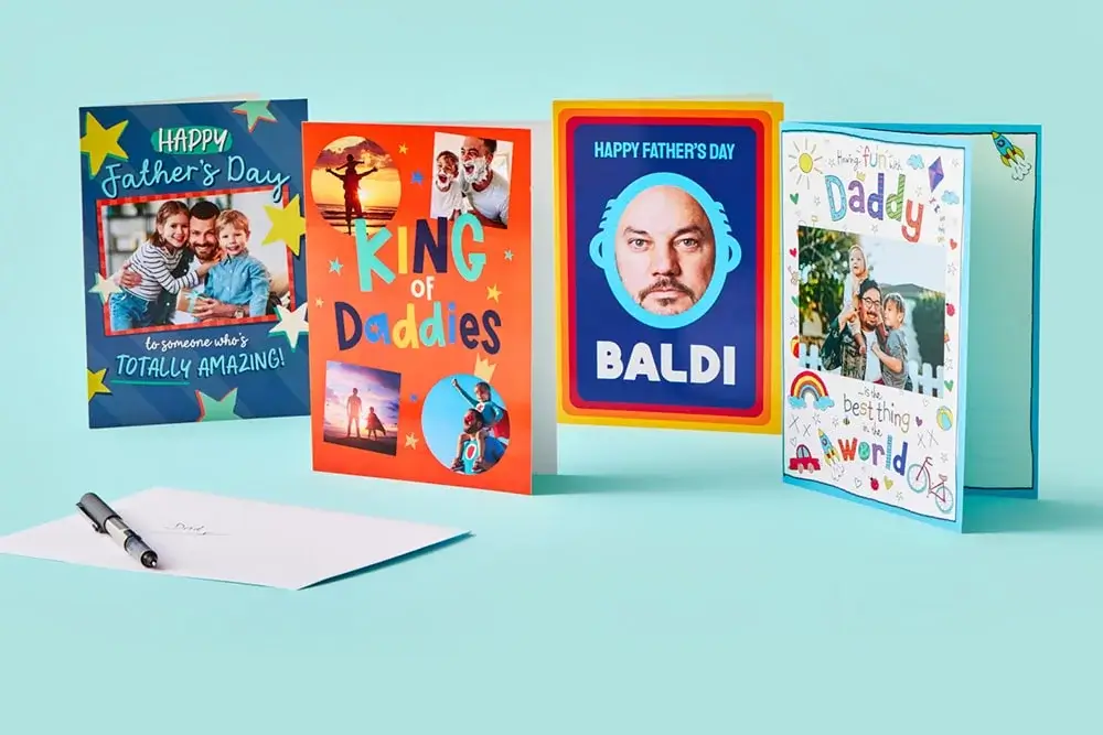 The image shows five Father's Day cards arranged in a row on a light blue background. Each card has a unique design and message, celebrating fathers. The image shows five Father's Day cards arranged in a row on a light blue background. Each card has a unique design and message, celebrating fathers.