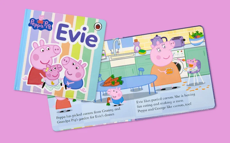 A Peppa Pig children’s board book titled ‘Evie,’ shown open to reveal colourful illustrated scenes of Peppa Pig characters inside.