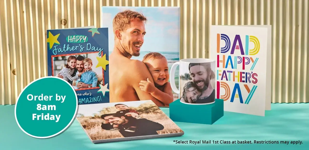 A display of Father's Day gifts including personalised photo cards, a mug with a child's photo, and a photo book. The background features a corrugated surface and the text 'Order by 4pm Thursday' in a green circle. There is also small text at the bottom right corner that reads 'Select Royal Mail 1st Class at basket. Restrictions may apply.