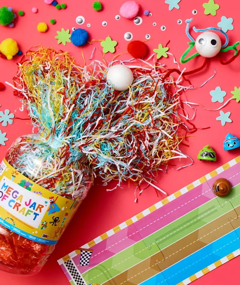 A colorful assortment of children’s activity items arranged on a yellow background, including an Avengers activity box with stickers and pencils, a jungle colouring book, decorative pens, and a Stitch-themed craft set.