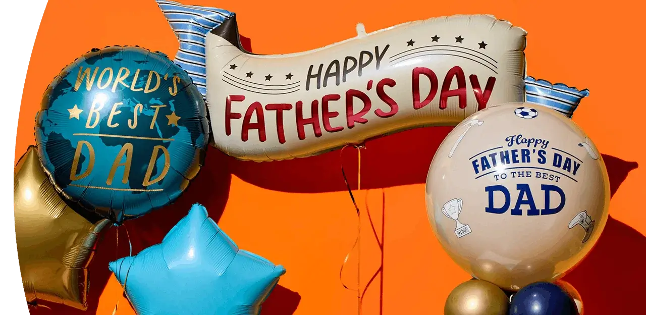Father’s Day balloon display with World’s Best Dad, Happy Father’s Day banner, and round Dad balloons on an orange background