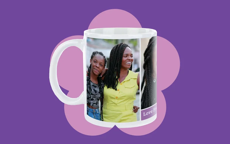 A white ceramic photo mug featuring a printed image wrapped around the side, displayed against a purple background with a pink flower shape.