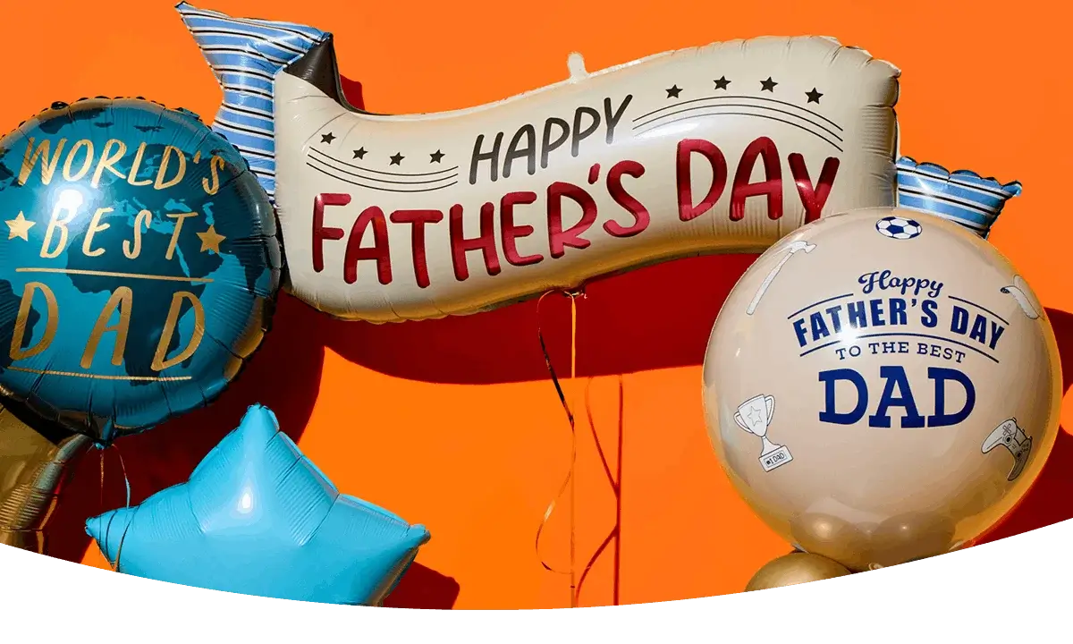 Father’s Day balloon display with World’s Best Dad, Happy Father’s Day banner, and round Dad balloons on an orange background