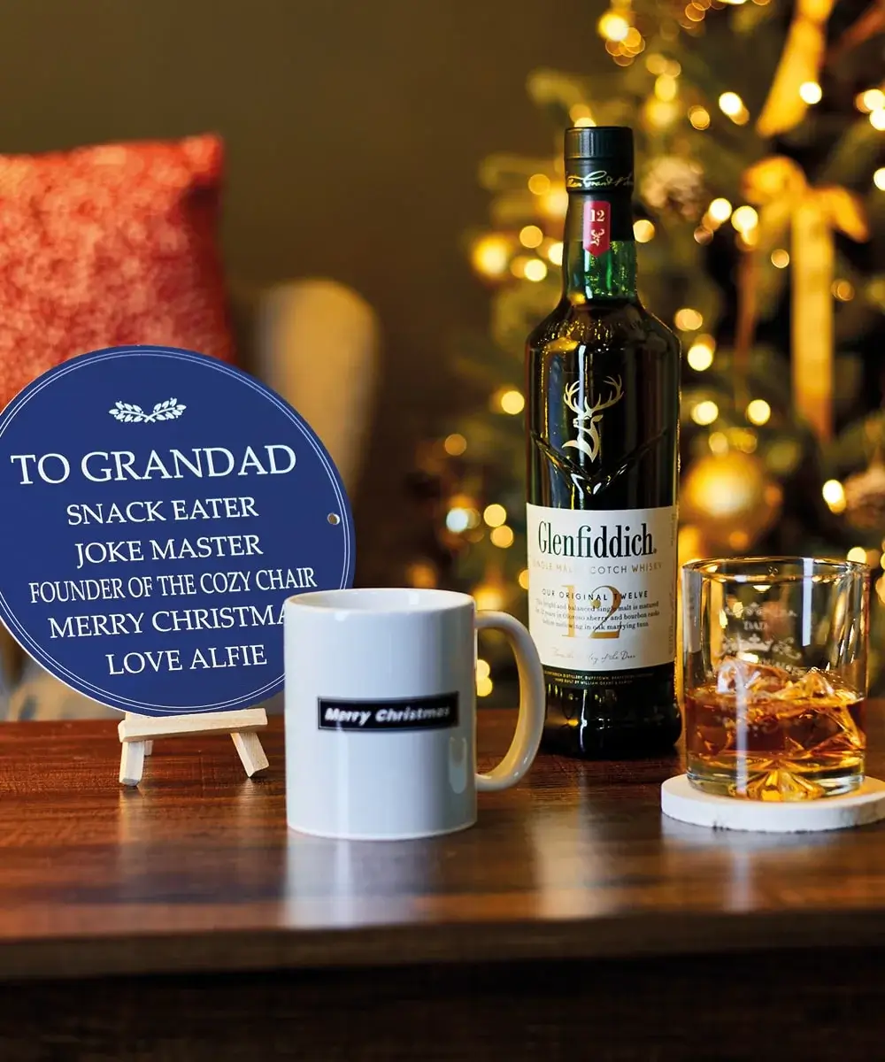 Christmas gift set for him with Lindt chocolates, a photo mug, a personalized notebook, and a funny card reading 'DAD IT'S XMAS! LAY OFF THE SPROUTS!' featuring cartoon sprouts and speech bubbles.