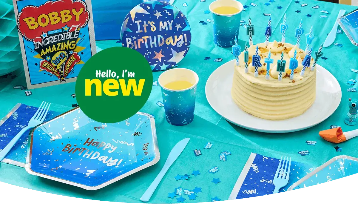 Blue birthday party table setting with a birthday cake, candles, themed plates and cups, party decorations, and scattered confetti on a turquoise tablecloth. Blue birthday party table setting with a birthday cake, candles, themed plates and cups, party decorations, and scattered confetti on a turquoise tablecloth.
