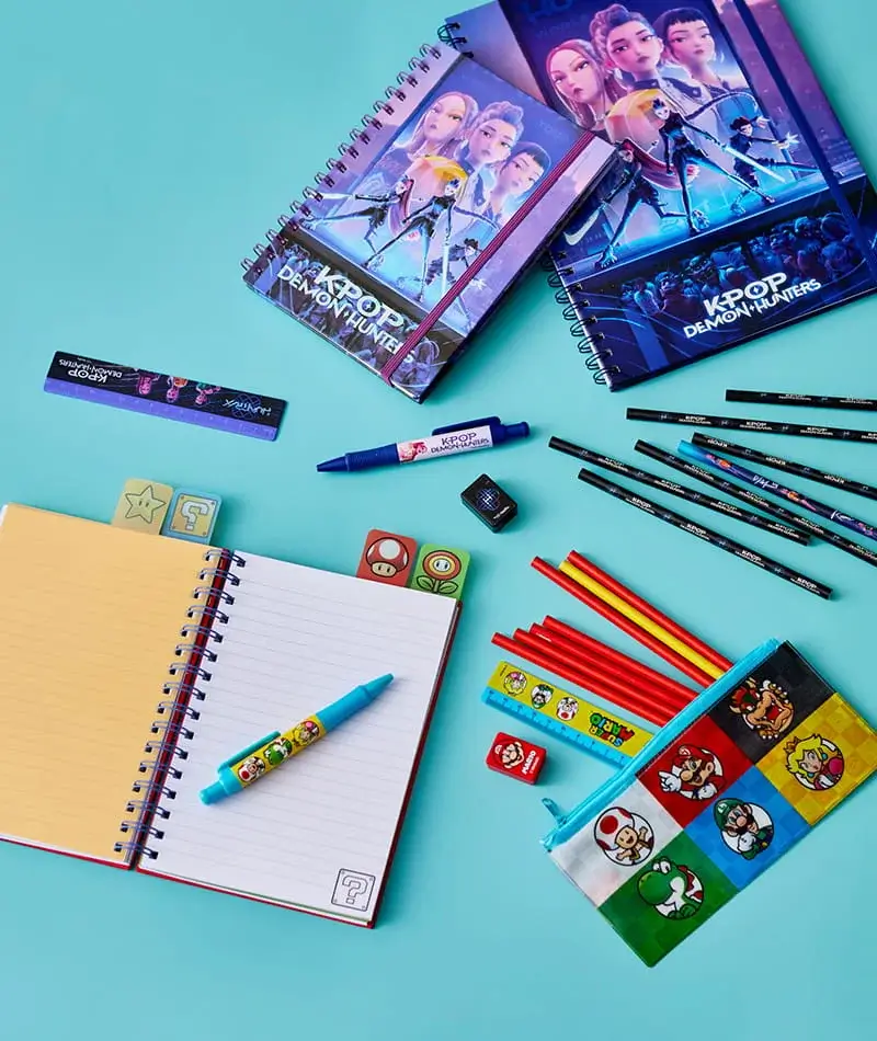 Character-themed stationery collection including notebooks, pens, pencils, erasers, and pencil cases displayed on a blue background. Character-themed stationery collection including notebooks, pens, pencils, erasers, and pencil cases displayed on a blue background.