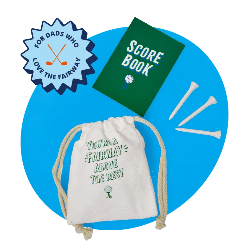 A golf‑themed gift set arranged on a blue circular background, featuring a green ‘Score Book,’ three white golf tees, and a canvas drawstring pouch printed with the message ‘You’re a fairway above the rest’ and a small golf ball illustration. A golf‑themed gift set arranged on a blue circular background, featuring a green ‘Score Book,’ three white golf tees, and a canvas drawstring pouch printed with the message ‘You’re a fairway above the rest’ and a small golf ball illustration.