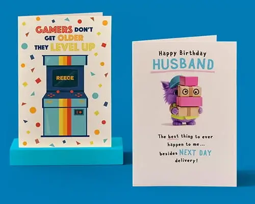Birthday cards featuring a personalised gaming-themed design and a humorous husband birthday card displayed on a blue background.