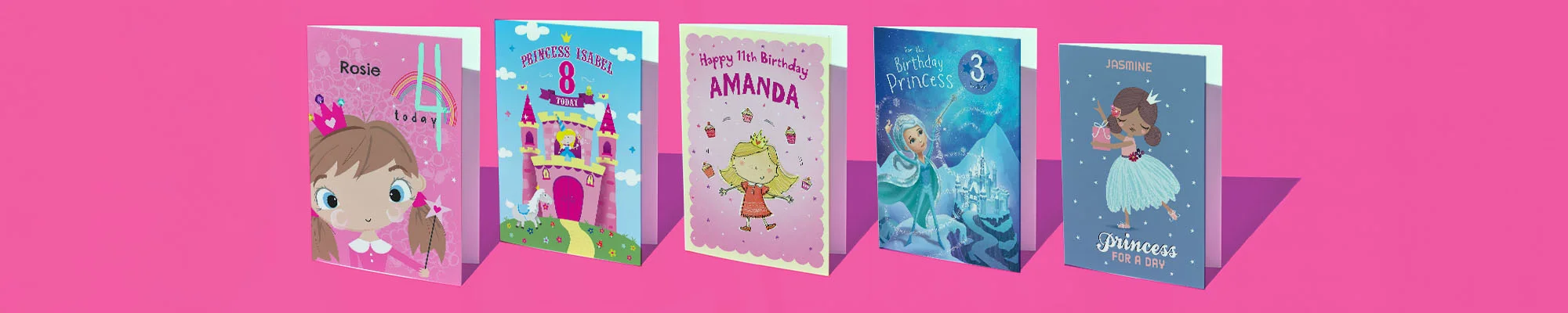 A collection of personalised princess-themed birthday cards displayed against a bright pink background, featuring designs including a princess portrait, a castle illustration, a birthday princess character, a magical ice castle scene, and a ‘Princess for a Day’ card, all personalised with names and ages. A collection of personalised princess-themed birthday cards displayed against a bright pink background, featuring designs including a princess portrait, a castle illustration, a birthday princess character, a magical ice castle scene, and a ‘Princess for a Day’ card, all personalised with names and ages.