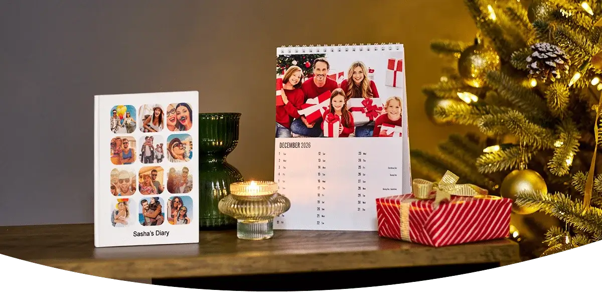 Wall calendars and planners on a desk, including a 2026 family organiser, a March 2026 calendar, notebooks, and a reed diffuser against a dark wall. Wall calendars and planners on a desk, including a 2026 family organiser, a March 2026 calendar, notebooks, and a reed diffuser against a dark wall.