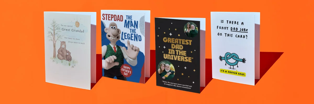 A selection of four Father’s Day greeting cards displayed against a bright orange background, including designs for Grandad and Stepdad, a black card reading ‘Greatest Dad in the Universe,’ and a humorous card with a knot illustration and the text ‘Is there a funny dad joke on this card? It’s a frayed knot. A selection of four Father’s Day greeting cards displayed against a bright orange background, including designs for Grandad and Stepdad, a black card reading ‘Greatest Dad in the Universe,’ and a humorous card with a knot illustration and the text ‘Is there a funny dad joke on this card? It’s a frayed knot.