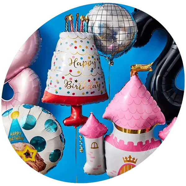 A colourful assortment of birthday foil balloons, including a cake, a castle, stars, and number shapes against a blue background.