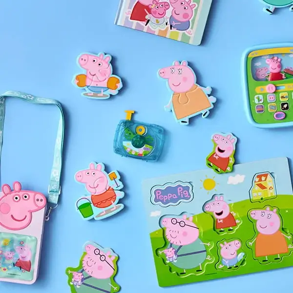 Peppa Pig themed collection including a personalised book, toys, stickers, lanyard, and activity set arranged on a blue background