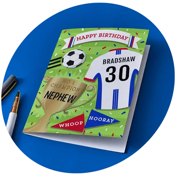 Hands holding a bold comic‑style Happy Birthday card with a bright pink envelope against a pink background.