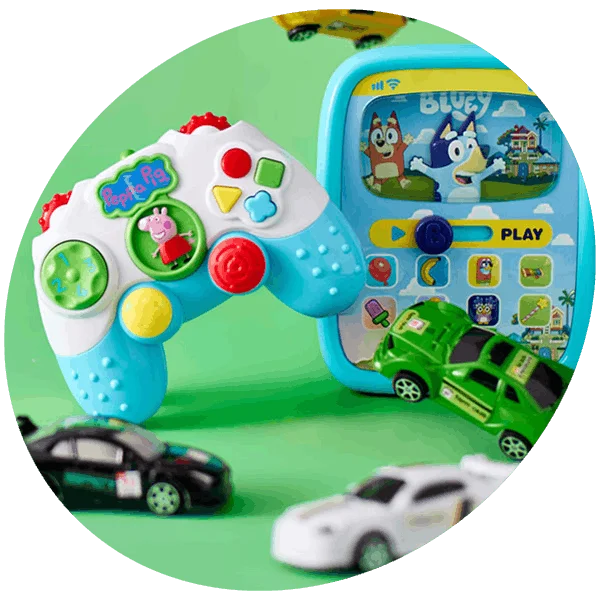 Kids toy set with colourful game controller, interactive tablet, and small toy cars on a green background