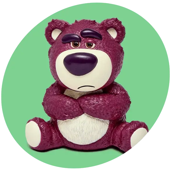 Purple toy bear figure with folded arms sitting against a green circular background.
