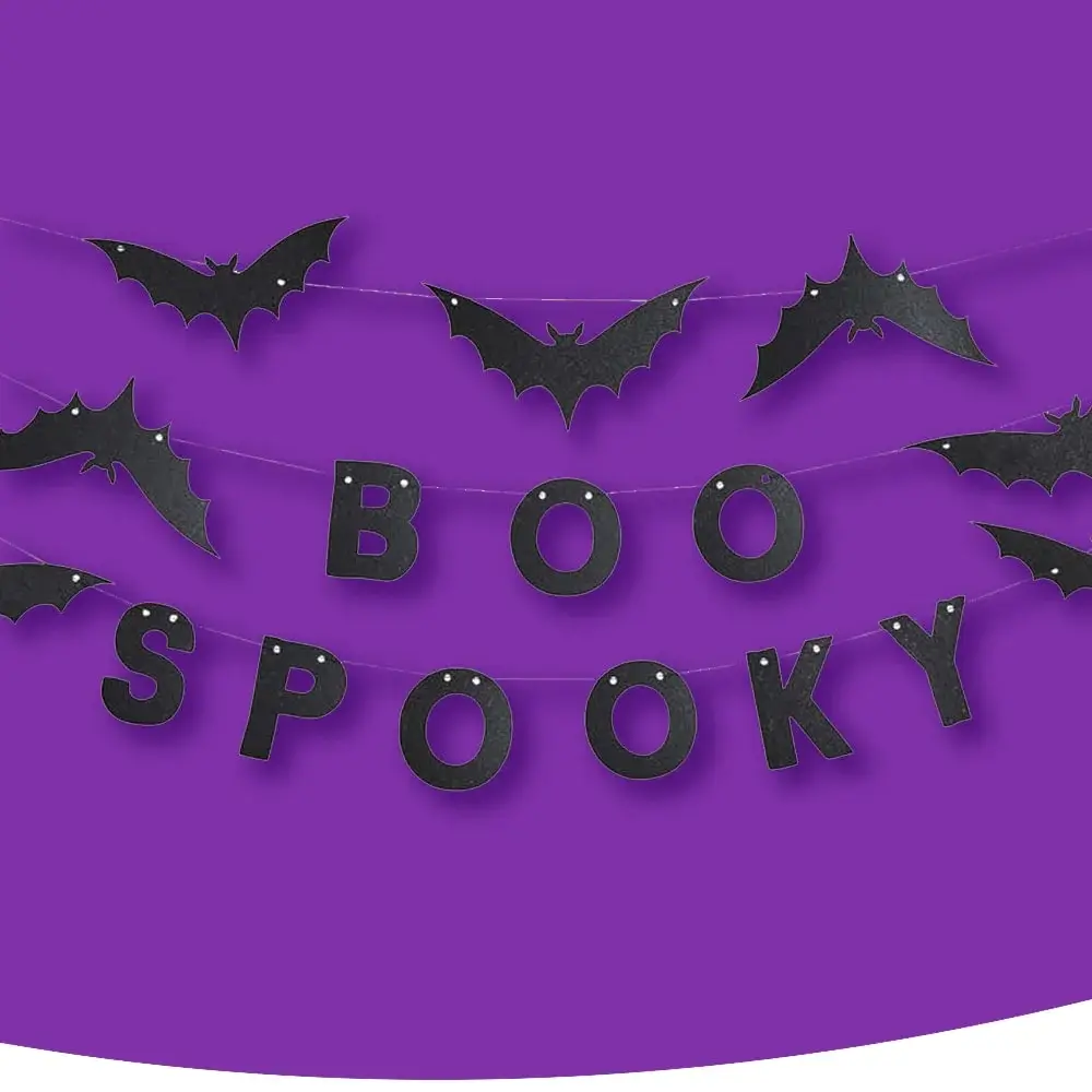 A purple background decorated with black bat cutouts and the words 