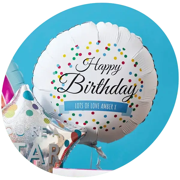 A round white balloon with colorful confetti dots and the text Happy Birthday printed in elegant black font, along with a blue banner that reads Lots of Love Amber X. Next to it is a silver star-shaped balloon with multicolored dots and partial text visible, set against a bright blue background.