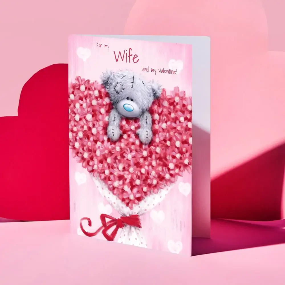 Valentine’s Day card featuring a collage of four romantic couple photos outdoors, decorated with red and gold hearts and the text “Your message here” and “Happy Valentine’s Day” in elegant script