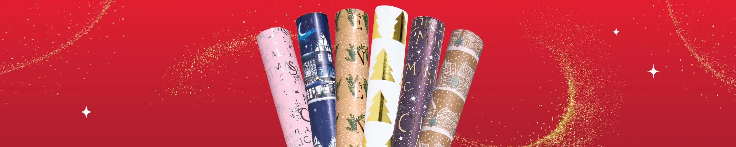 Six rolls of Christmas wrapping paper in assorted designs, including pink with festive text, navy with winter houses, brown with holly, white with gold trees, purple with stars, and kraft with white houses, displayed against a red background with gold glitter accents.
