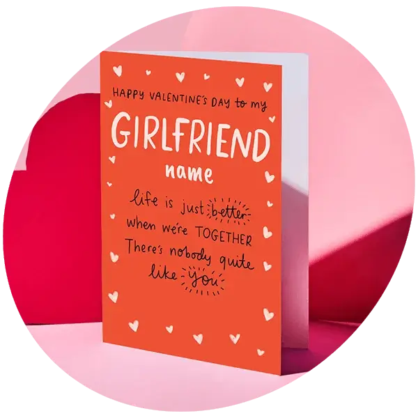 A pair of black boxer shorts with a red waistband and a playful pink aubergine pattern, displayed on a pink background.