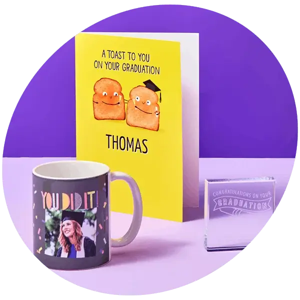 Graduation gift set with personalised card, photo mug, and keepsake block displayed on a purple background