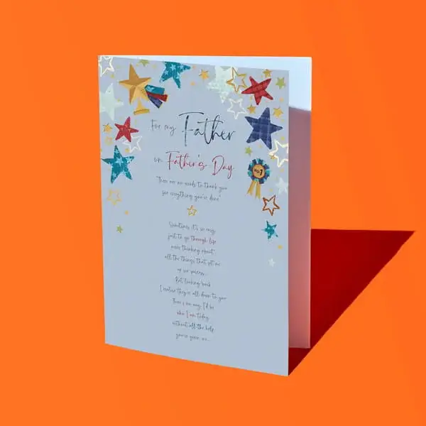 Light blue fathers day card on an orange background decorated with colorful stars and a father’s day message text