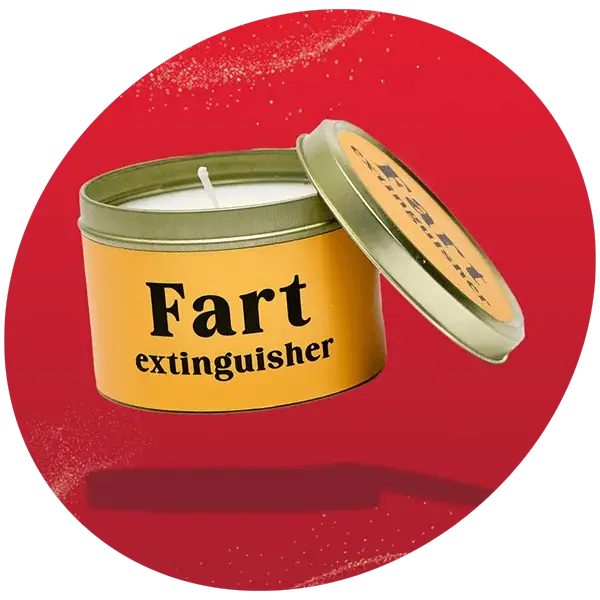 Round yellow tin candle with a green lid, featuring bold black text that reads Fart extinguisher, displayed against a bright red background.