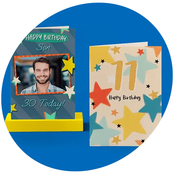Two birthday cards on a blue background, one with colorful stars and text reading “Happy Birthday Son 30 Today!” and the other featuring a large gold number 11 surrounded by multicolored stars with “Happy Birthday” text.