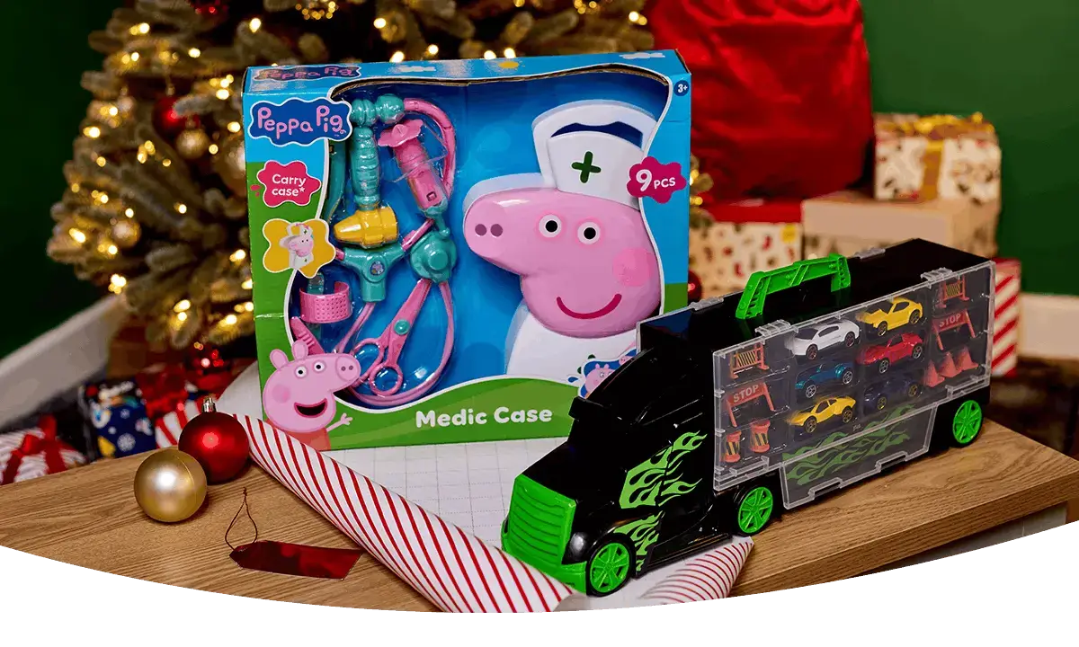 Bluey shopping basket toy and Colour Buddies craft set displayed among wrapped Christmas presents and festive gift wrap on a grey rug.