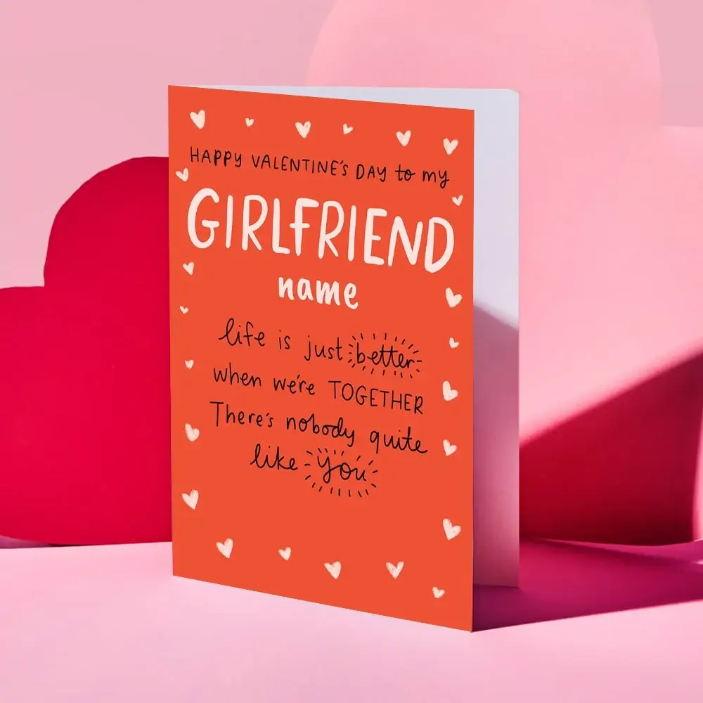 Valentine’s Day card featuring a collage of four romantic couple photos outdoors, decorated with red and gold hearts and the text “Your message here” and “Happy Valentine’s Day” in elegant script