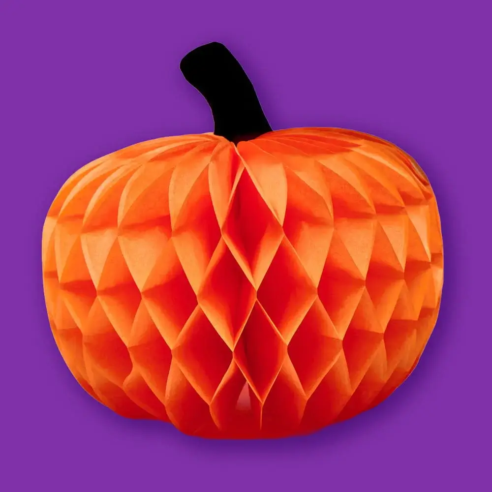 Honeycomb pumpkin Halloween decoration in orange with a black stem, displayed against a purple background.