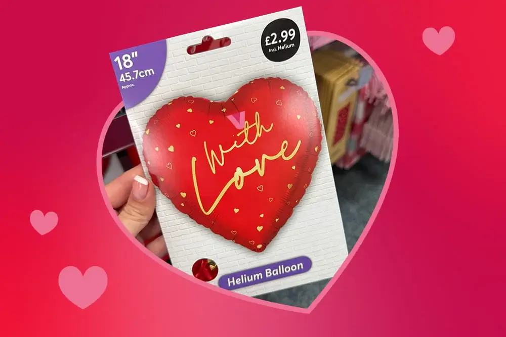 Heart‑shaped red helium balloon package with the words With Love displayed against a pink background with scattered hearts.