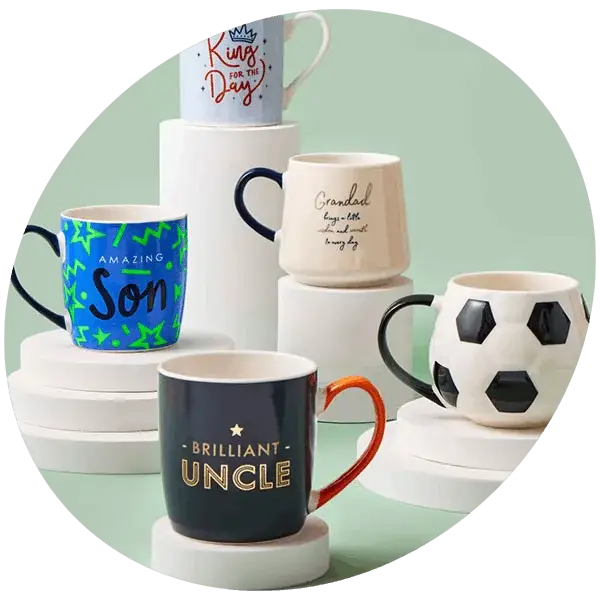 A selection of themed mugs displayed on white platforms, including designs for family members and a football‑patterned mug.