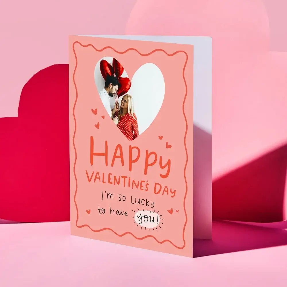 Valentine’s Day card featuring a collage of four romantic couple photos outdoors, decorated with red and gold hearts and the text “Your message here” and “Happy Valentine’s Day” in elegant script