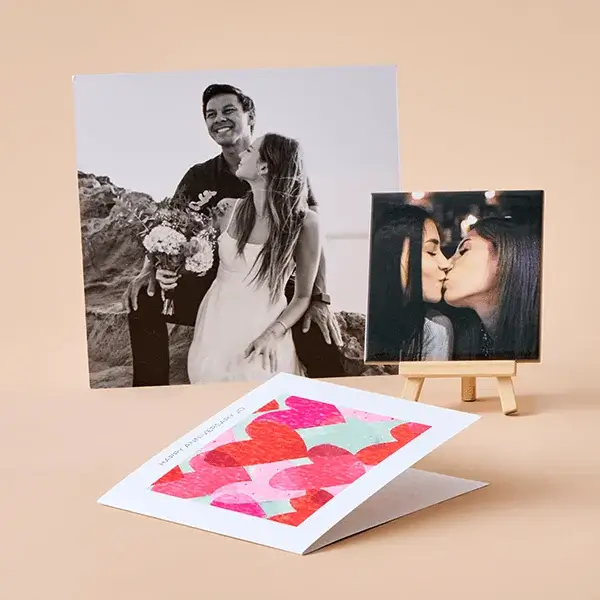 Personalised photo gift collection featuring a photo print, photo block, and greeting card displayed on a soft beige background.