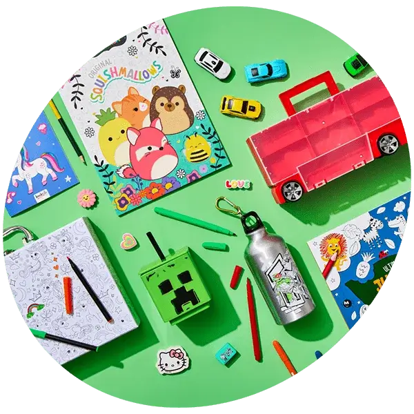 Colorful children's gifts including toys, books, crayons, and accessories displayed on a green background.