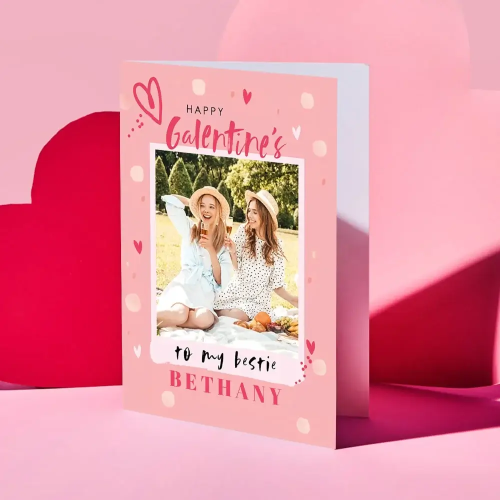 Valentine’s Day card featuring a collage of four romantic couple photos outdoors, decorated with red and gold hearts and the text “Your message here” and “Happy Valentine’s Day” in elegant script